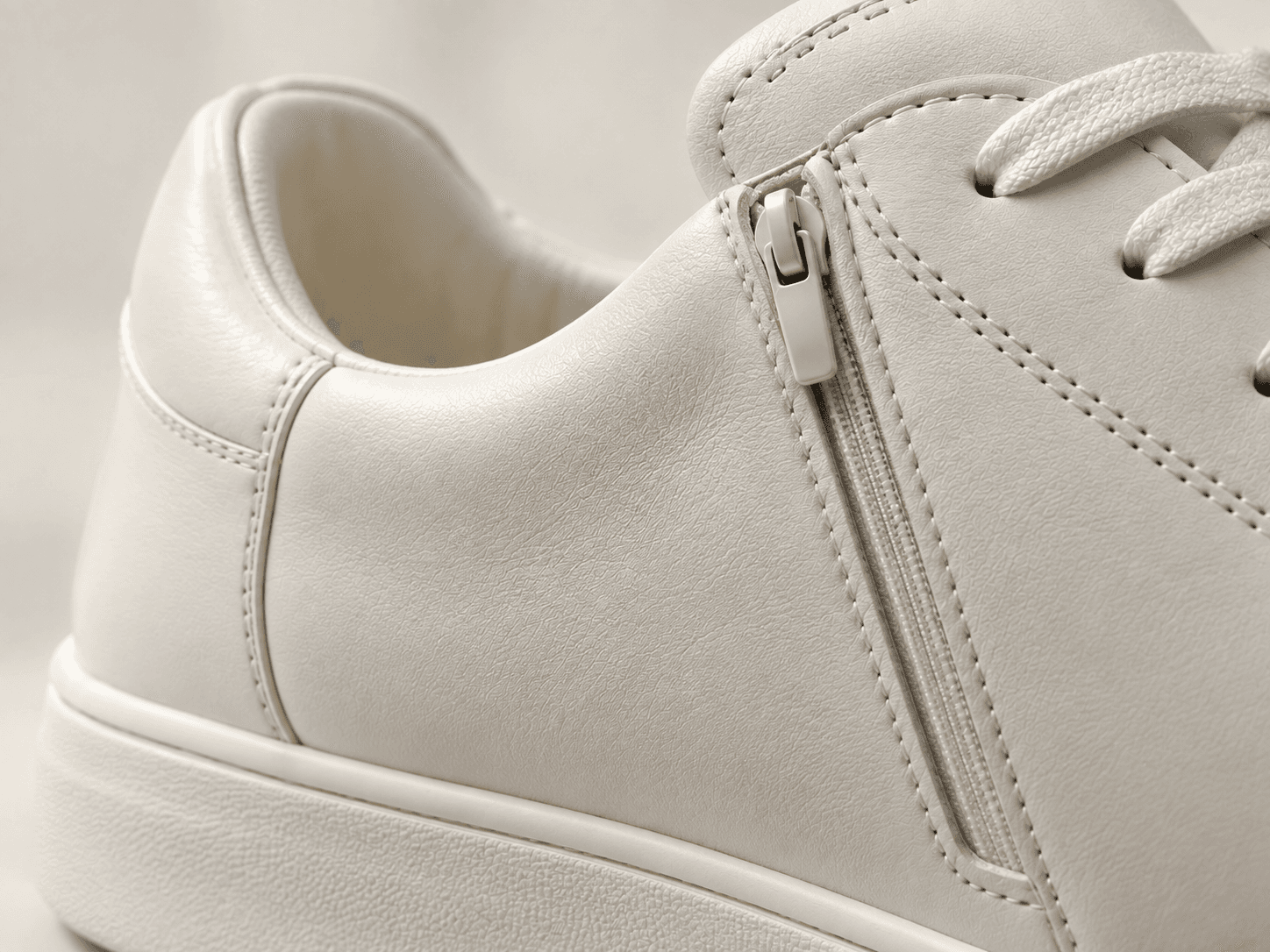 Footwear zipper application